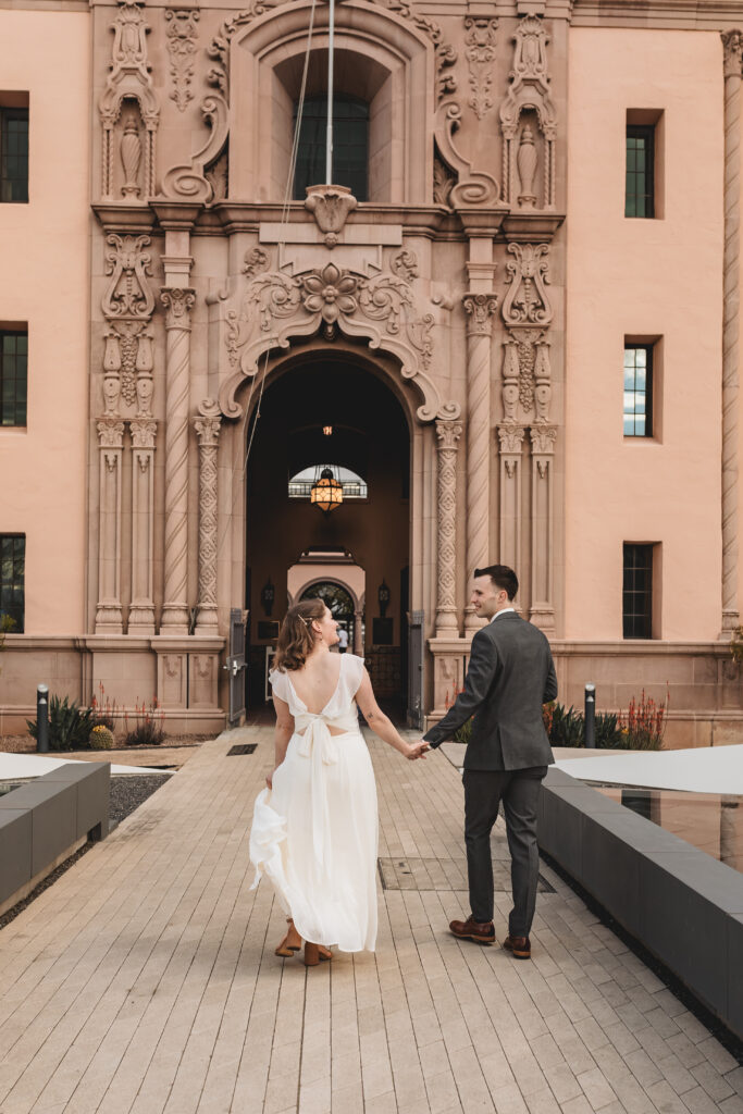 Bride and groom holding hands during their Tucson bridal session at the Historic Courthouse