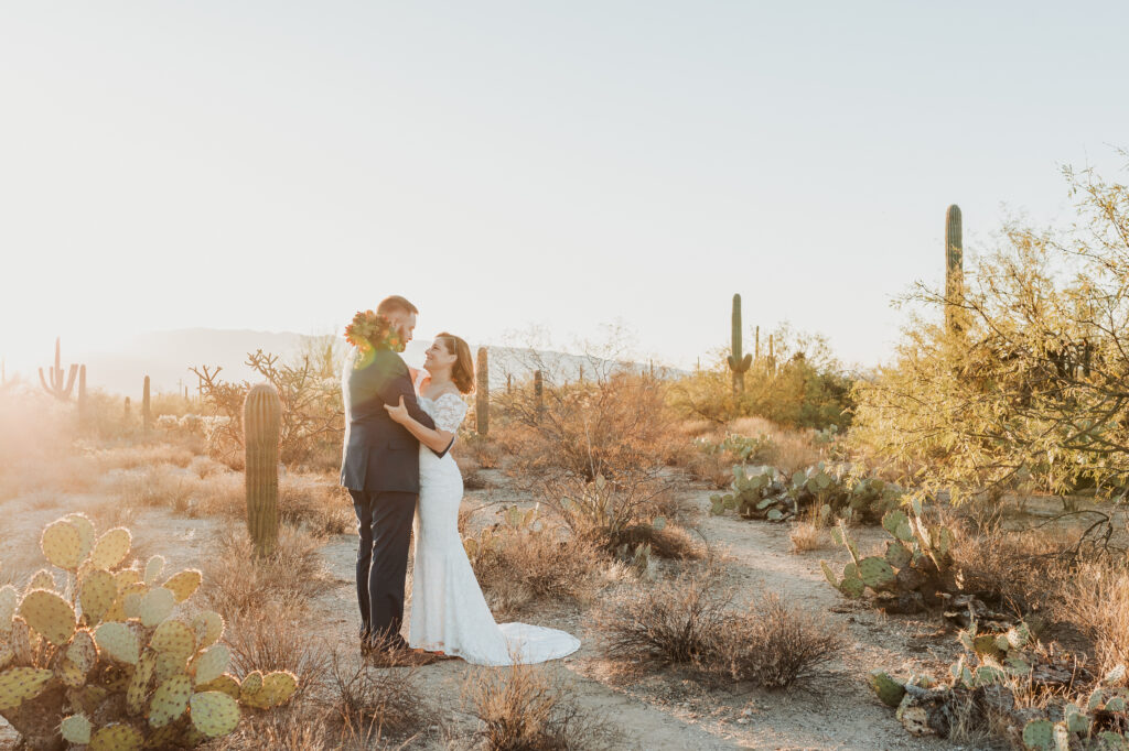 Desert landscape surrounds couple during emotional Sabino Canyon elopement ceremony