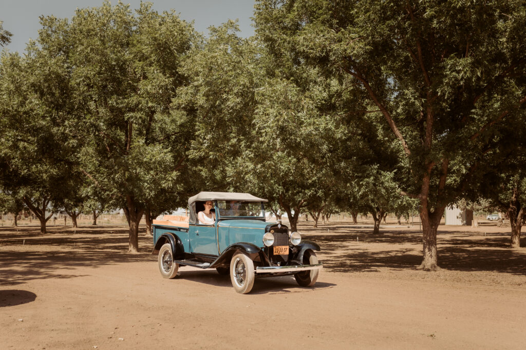 Lee of Lee's pecan farm in willcox arizona driving up granddaughter in his vintage truck